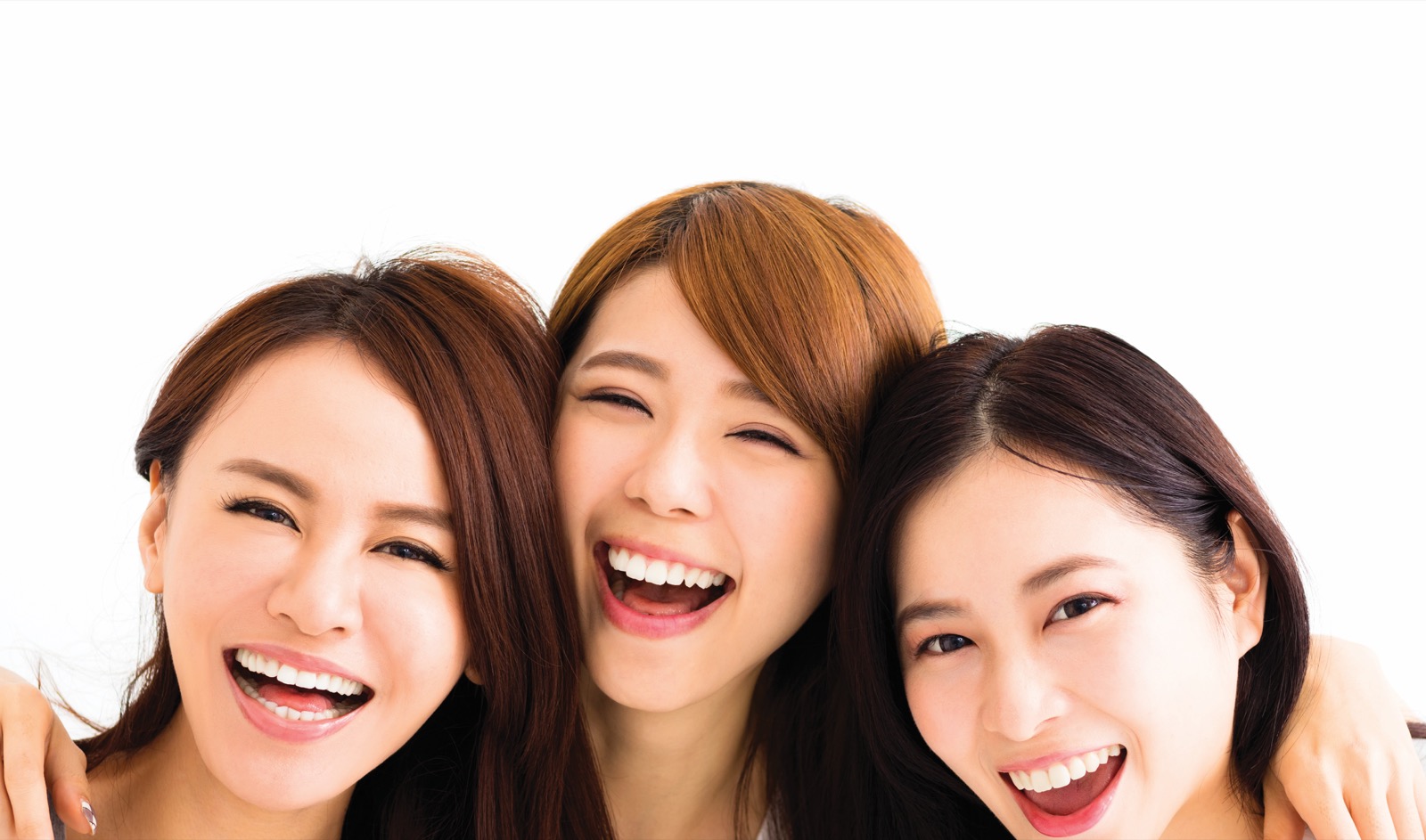 Three women laughing together