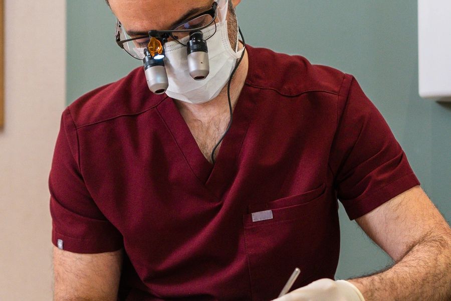 Dentist reassuring patient before sedation procedure
