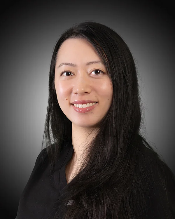 Dr. Miranda Wang assessing bone health around implant