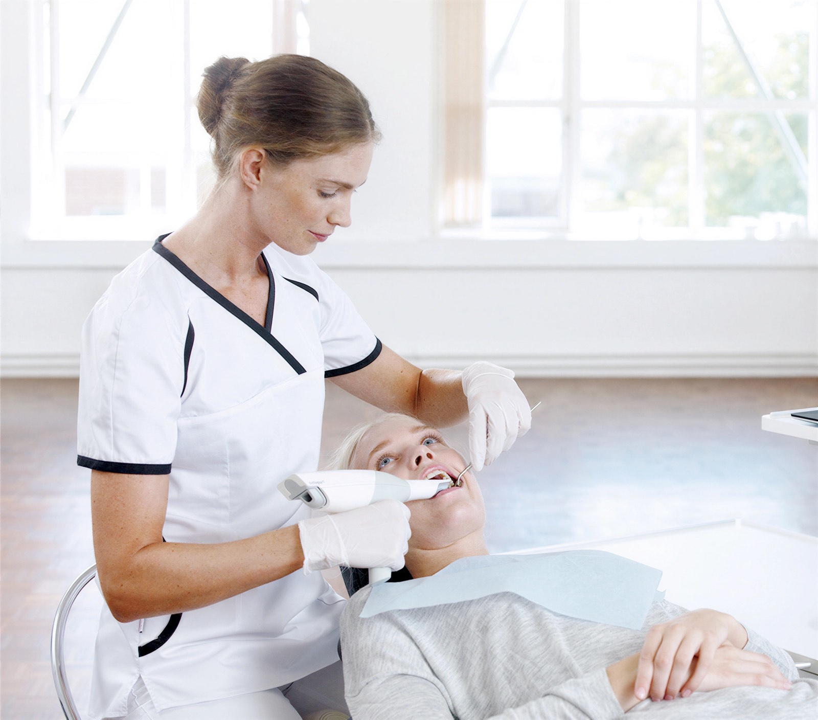 A hygienist demonstrating brushing technique