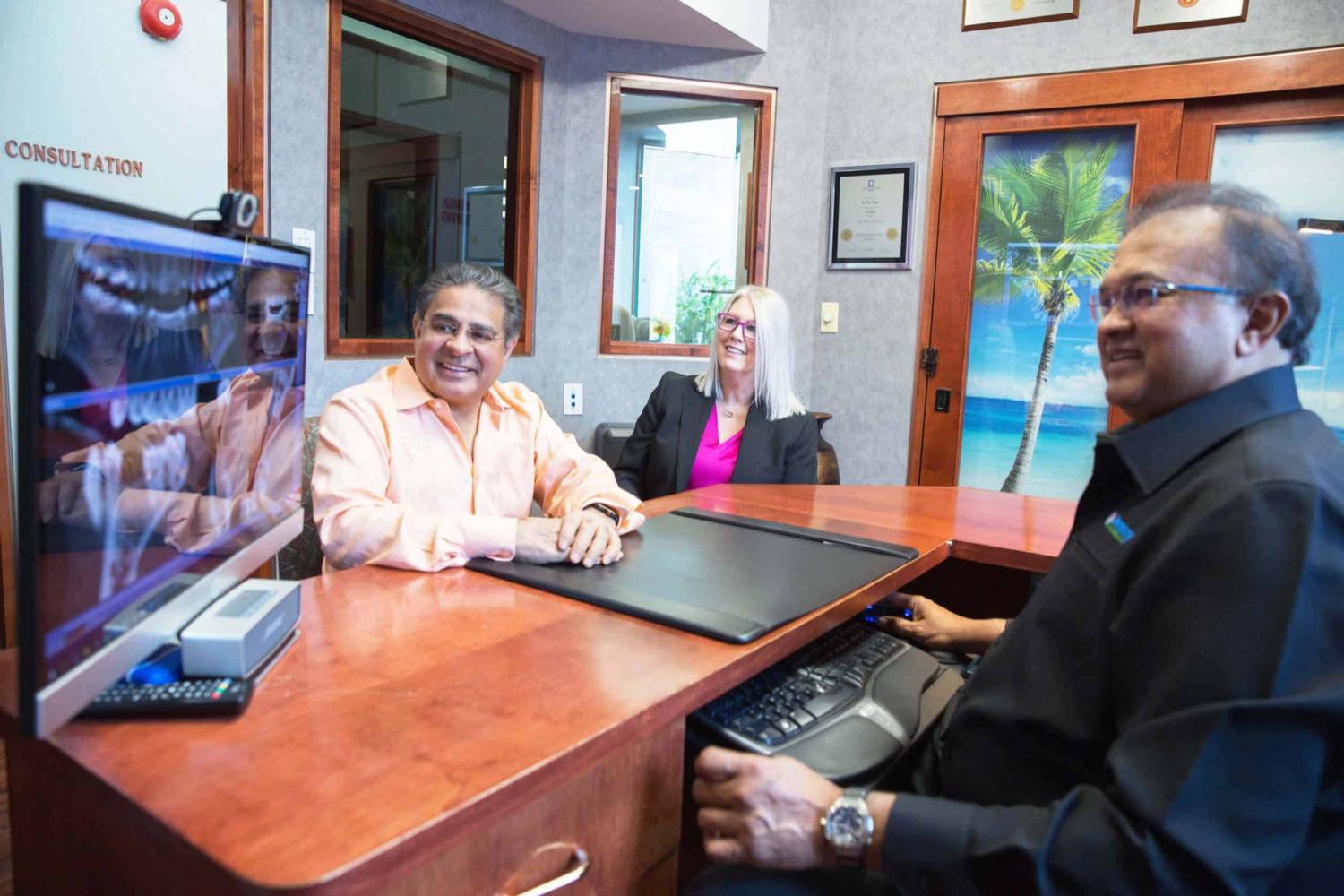A consultation at Dentistry at Vitality Health, with images on screen